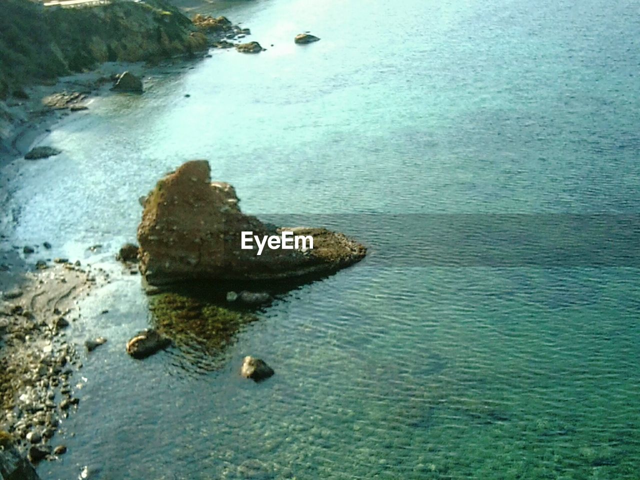 VIEW OF ROCKS IN WATER