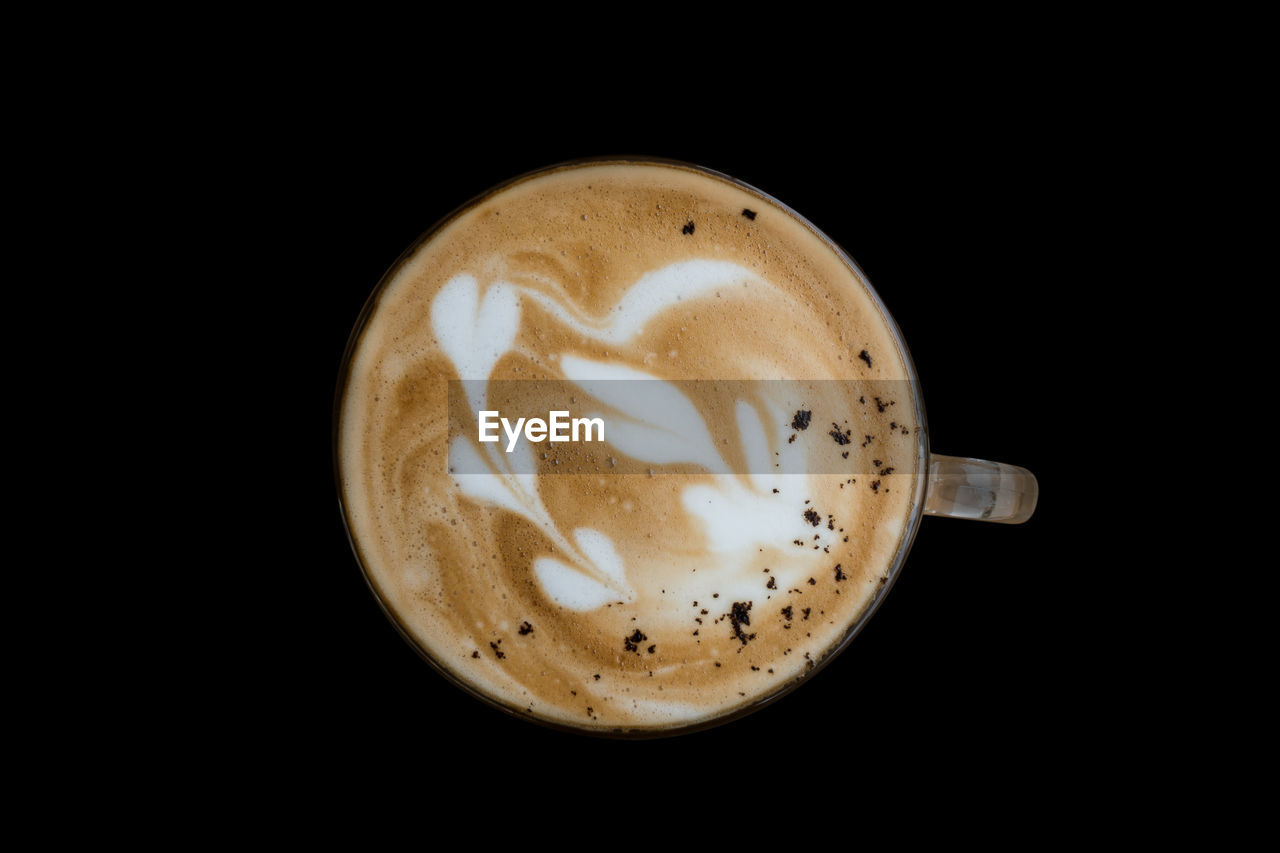 Close-up of coffee cup on black background