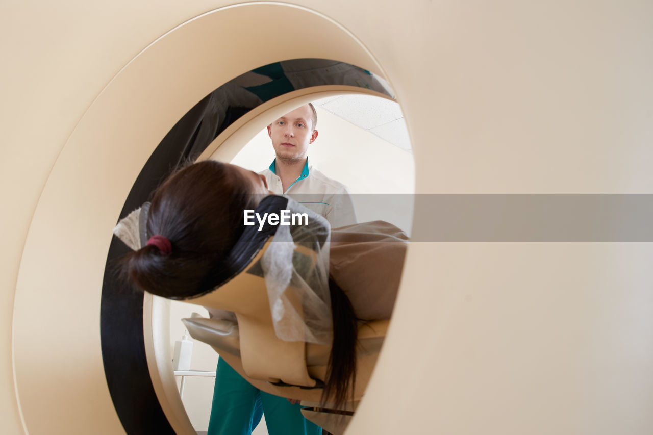 Doctor preparing patient for mri