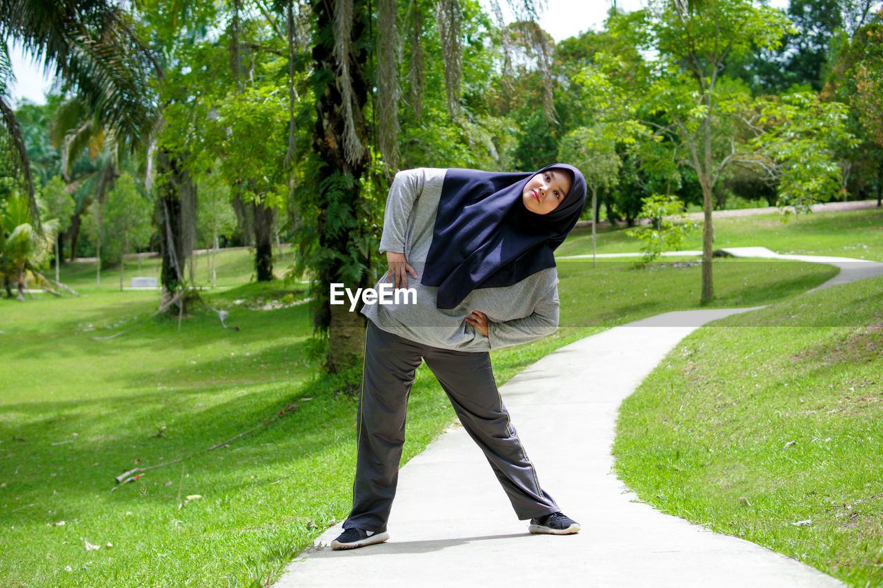 FULL LENGTH OF MAN STANDING IN PARK