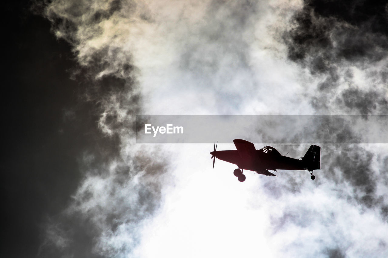 Low angle view of airplane flying in sky