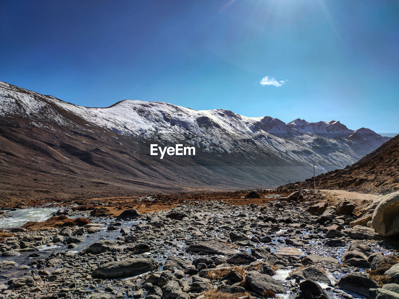 Scenic view of rocky mountains against clear blue sky