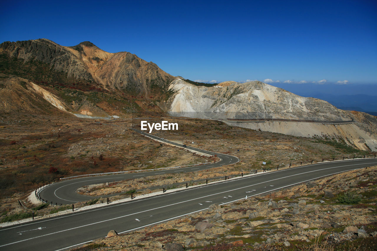 Scenic view of mountain road against sky