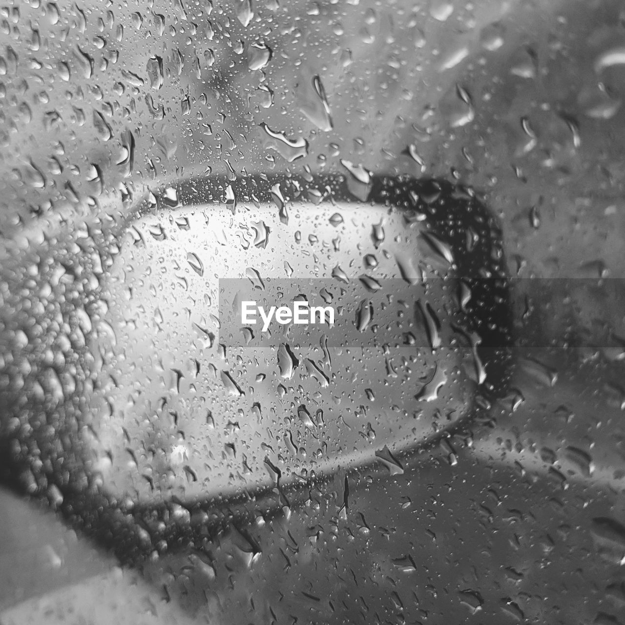 Close-up of raindrops on glass window