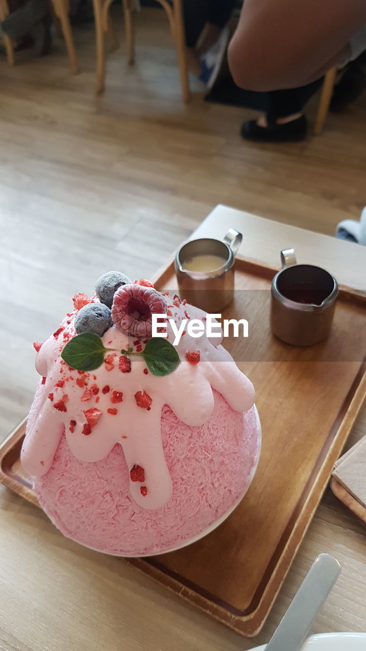 High angle view of ice cream served on table