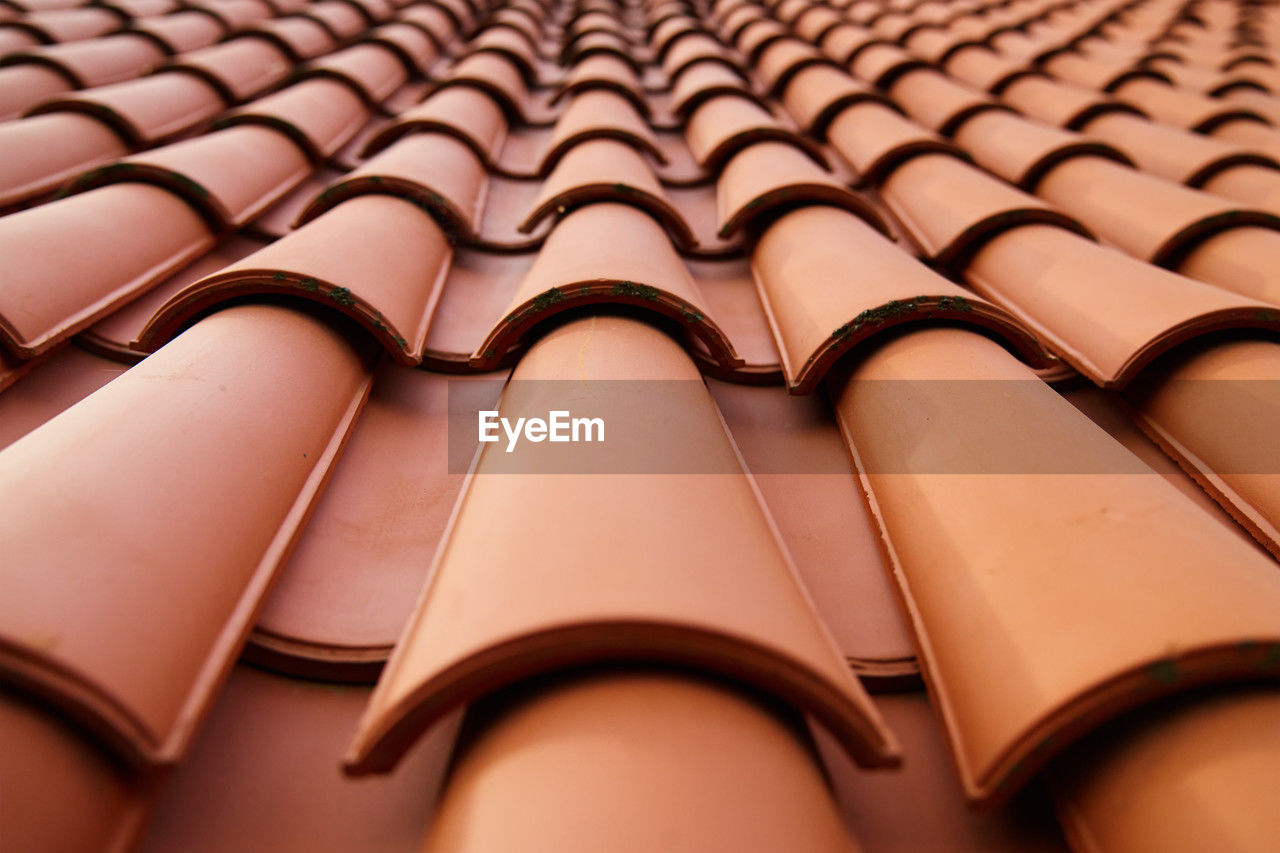 Red ceramic roof tiles pattern on building