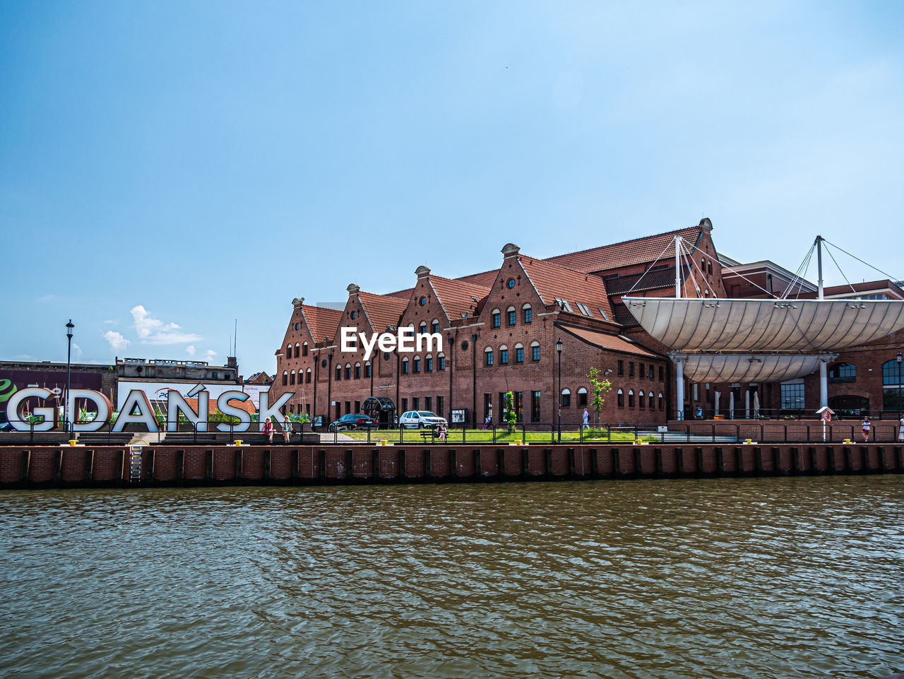 VIEW OF BUILDINGS BY RIVER