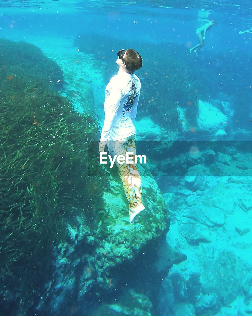 High angle view of man swimming in sea