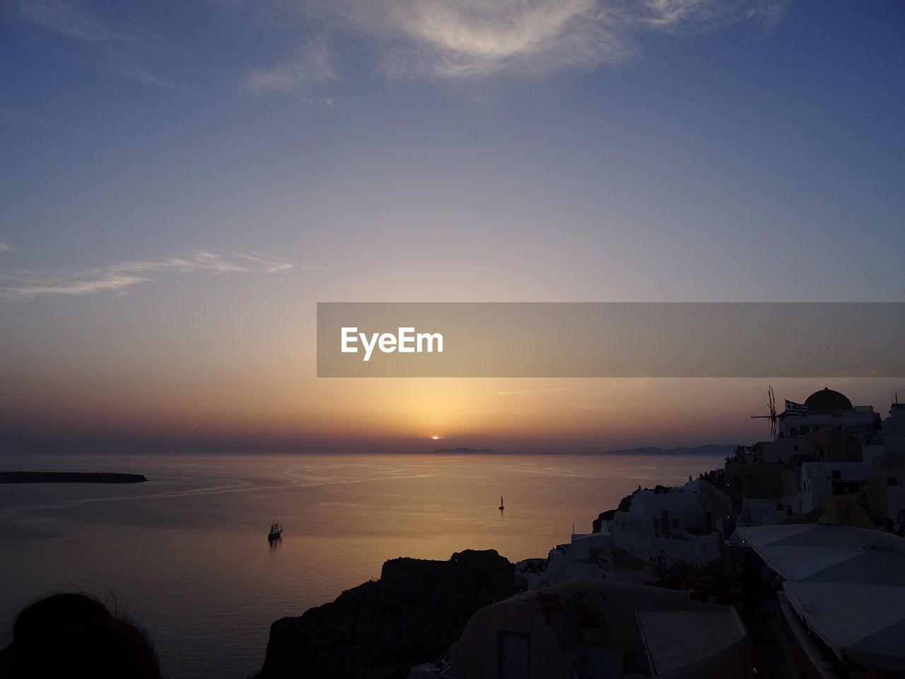 High angle shot of townscape against calm sea