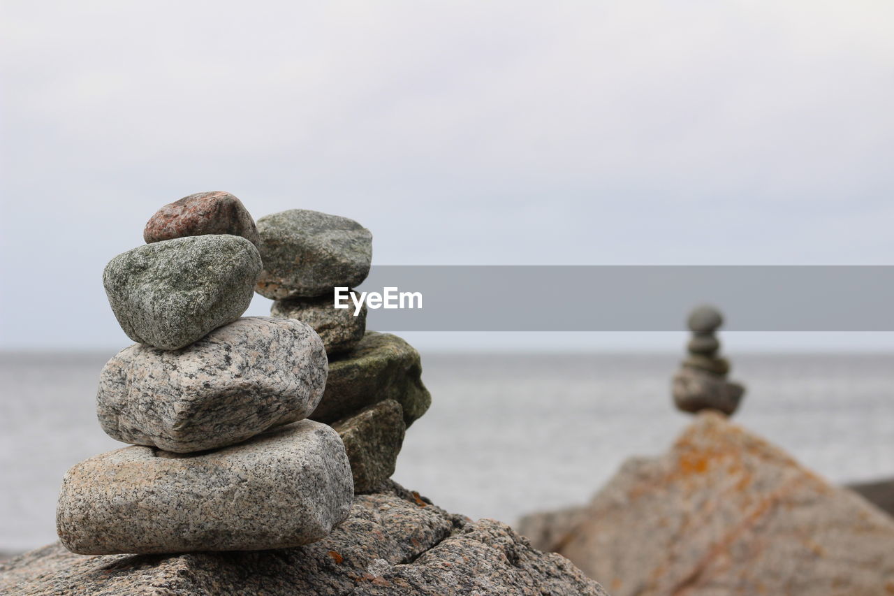 STACK OF STONES IN SEA