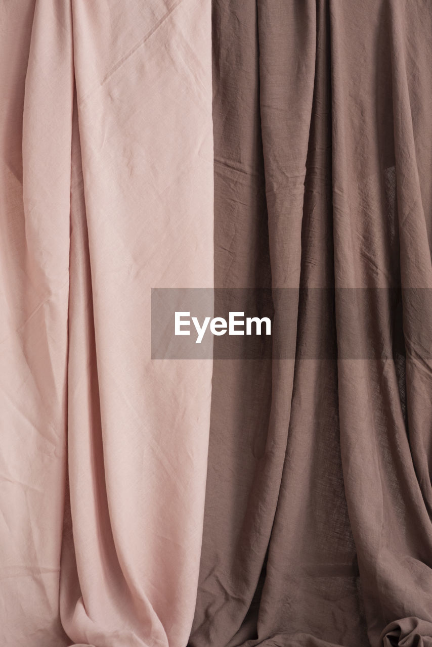 textile, clothing, full frame, no people, backgrounds, indoors, outerwear, close-up, wrinkled, pattern, brown, fashion, hanging, crumpled, curtain, interior design