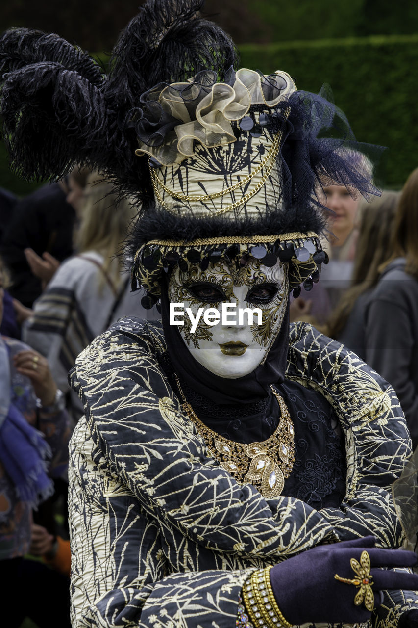 mask - disguise, carnival, disguise, celebration, tradition, costume, mask, clothing, festival, event, arts culture and entertainment, adult, human face, person, outdoors, women, day, performance, masque, traditional clothing, men, portrait, focus on foreground