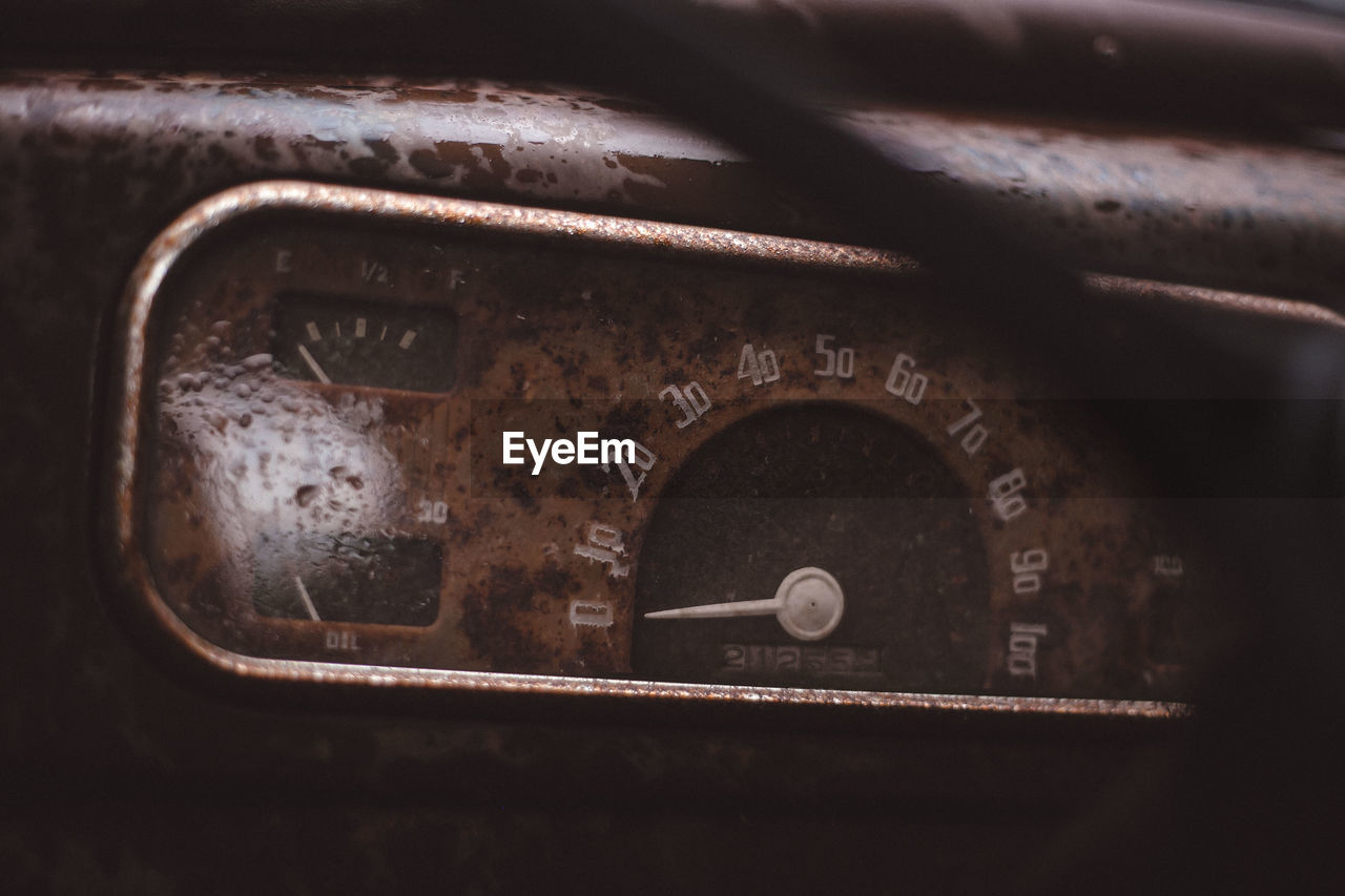 Close-up of speedometer in abandoned car