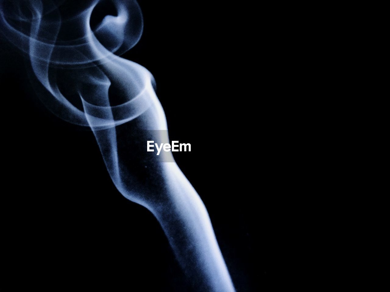 Close-up of smoke against black background