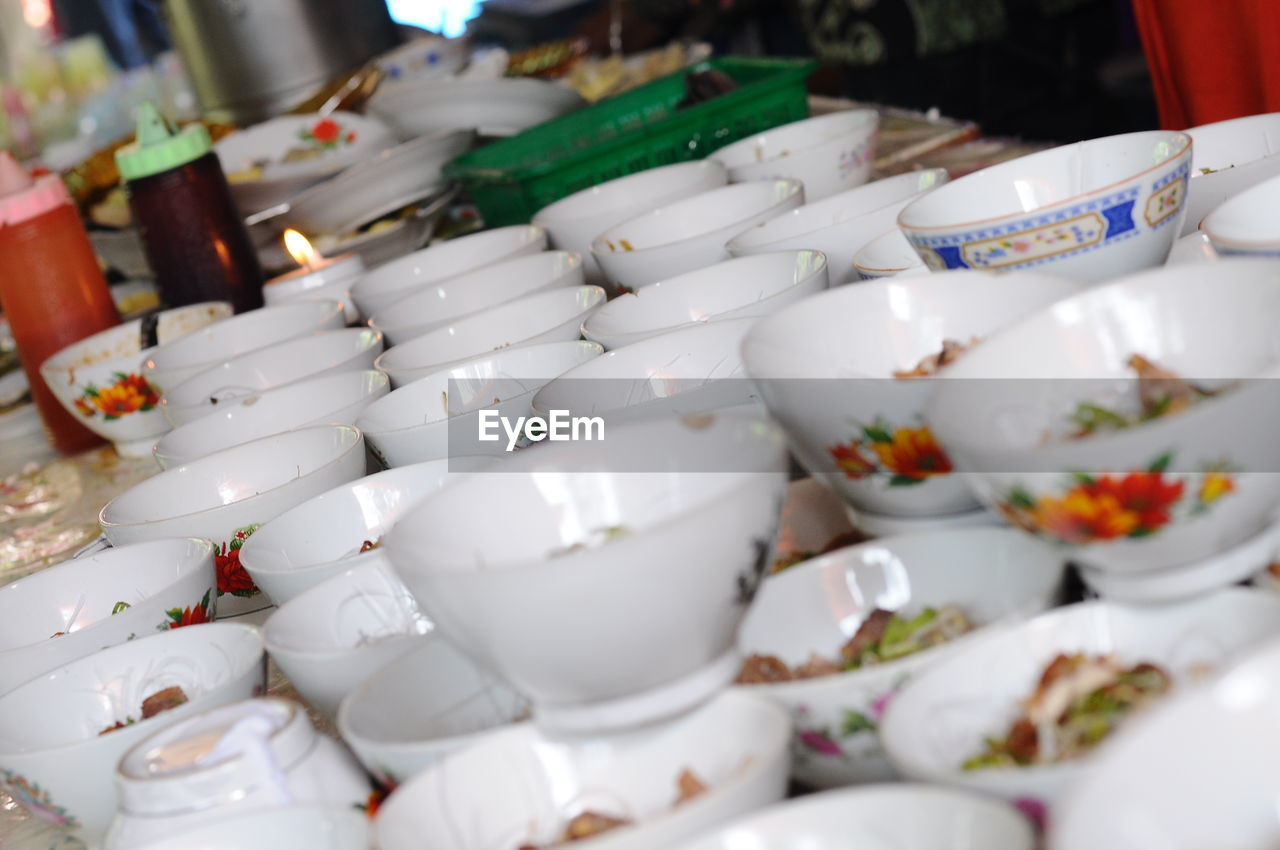 meal, food and drink, large group of objects, ceramic, tableware, porcelain, no people, food, selective focus, party, white, indoors, crockery, cup, tradition, retail, celebration, abundance, business, brunch, market, arrangement