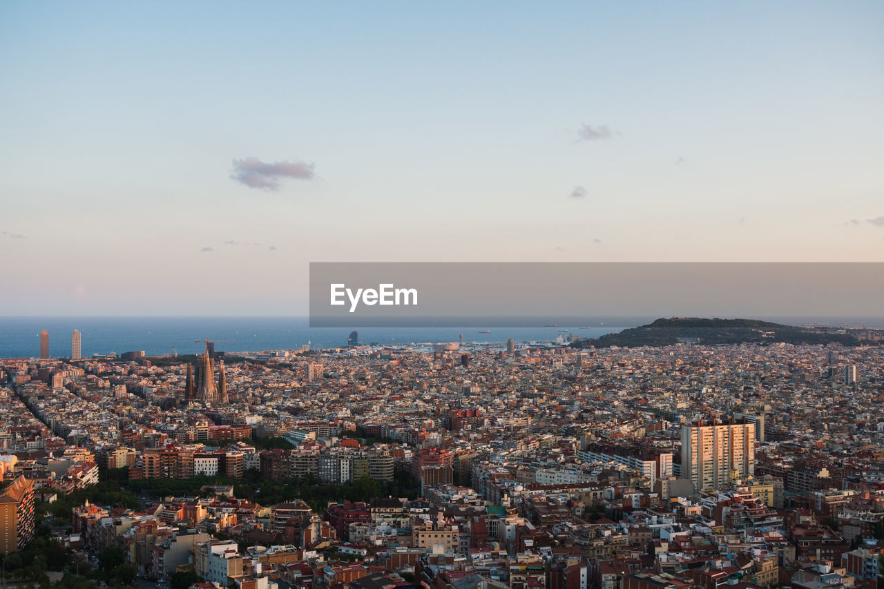 High angle view of barcelona at sunset