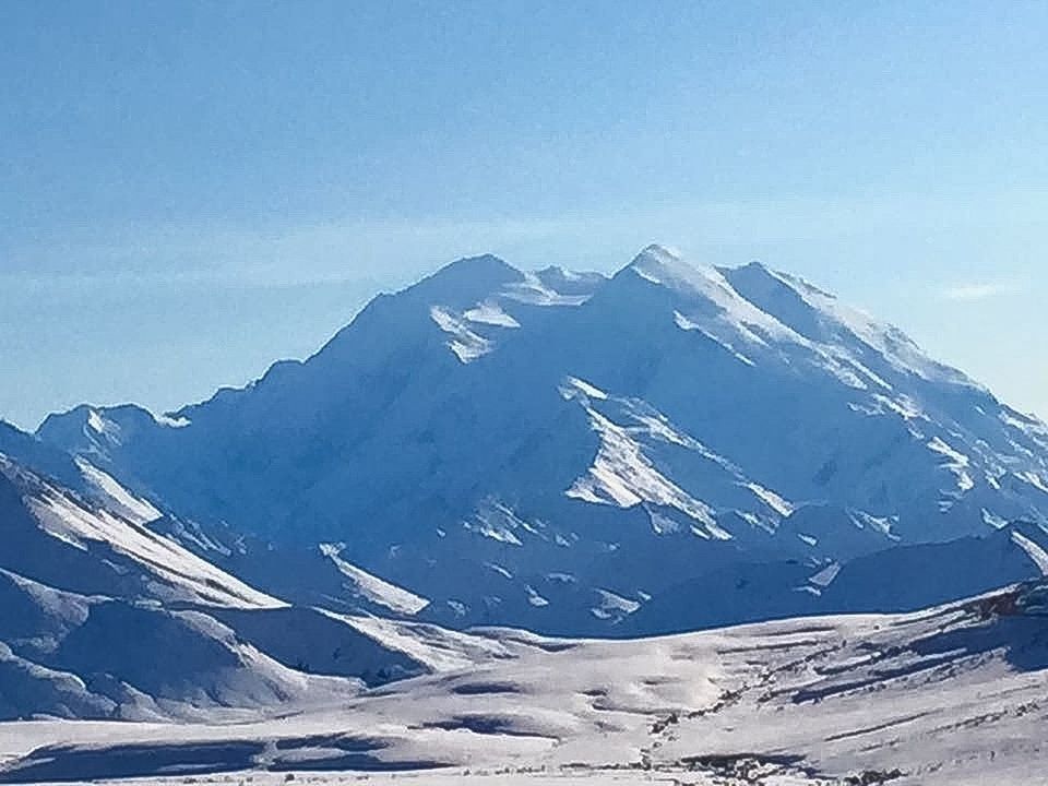 SCENIC VIEW OF SNOW COVERED MOUNTAINS AGAINST SKY