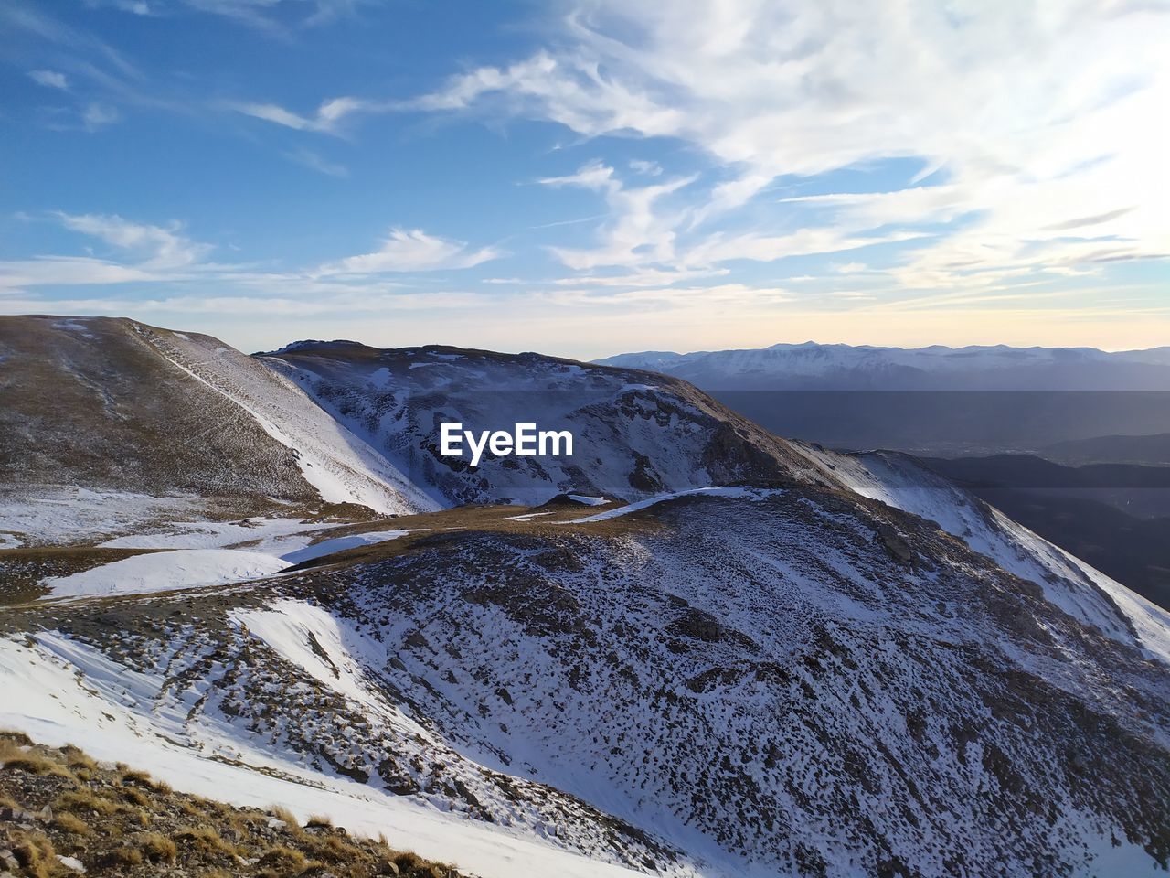 Scenic view of snowcapped mountains against sky