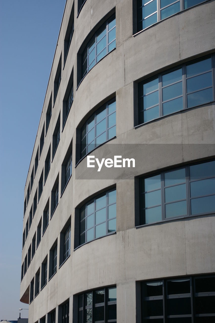 APARTMENT BUILDING AGAINST SKY