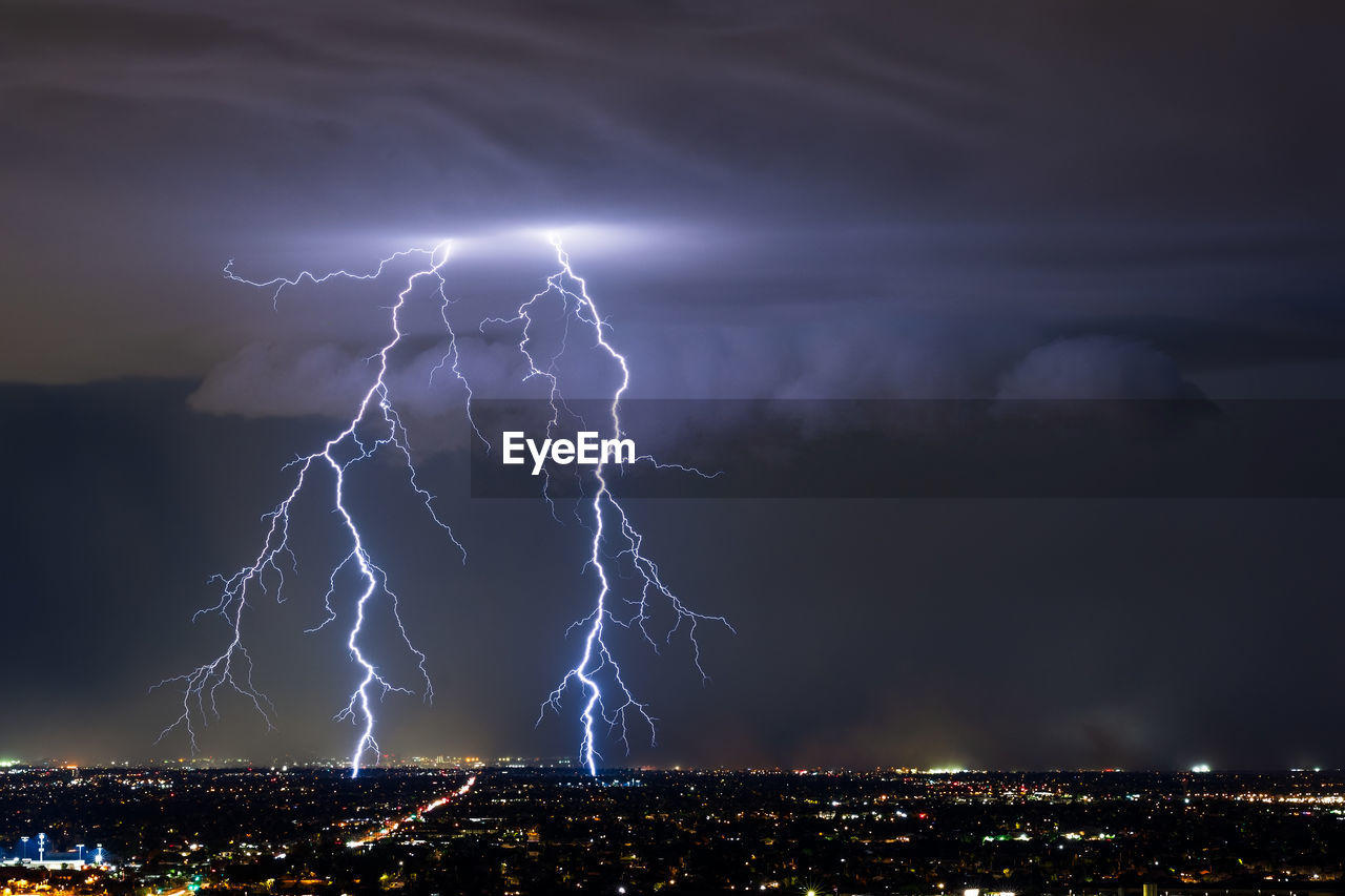 Dramatic lightning strikes from a thunderstorm over phoenix, arizona