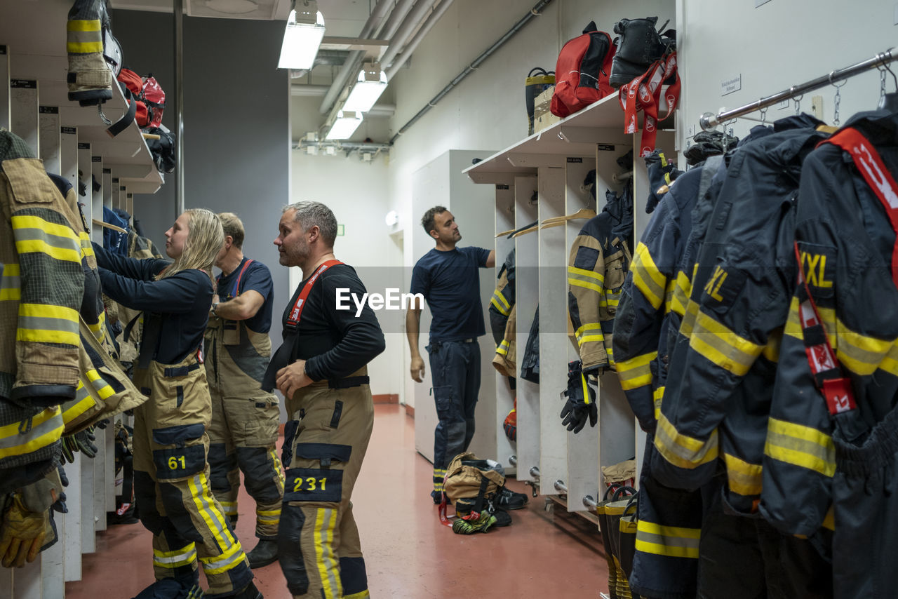 Firefighters changing in locker