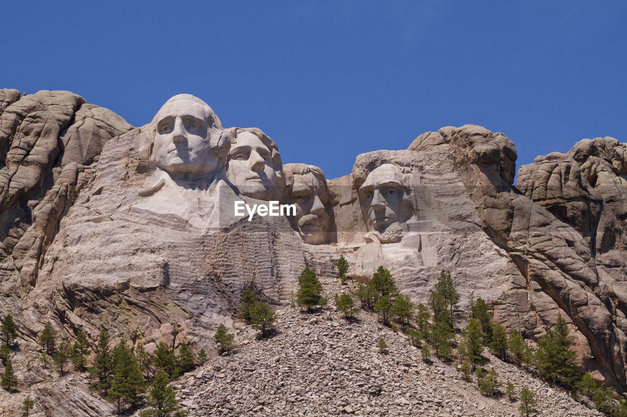 Low angle view of mt rushmore national monument against clear sky