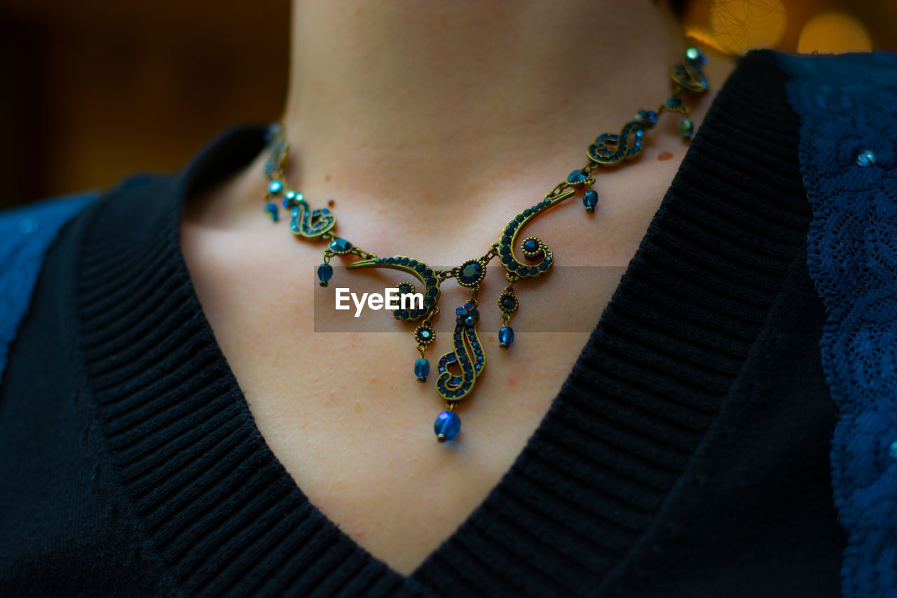 Close-up of woman wearing necklace