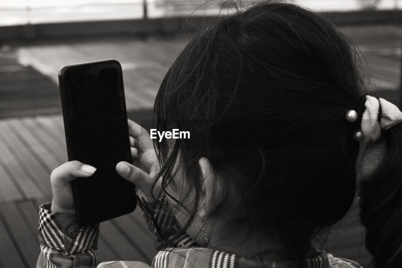 A girl is using a smartphone