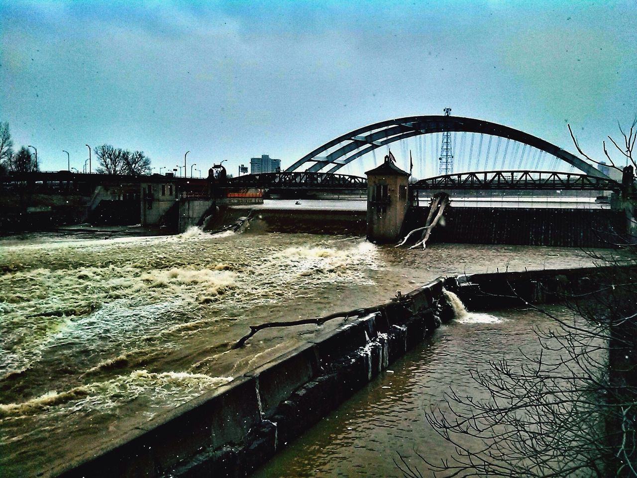 VIEW OF BRIDGE OVER RIVER AGAINST SKY