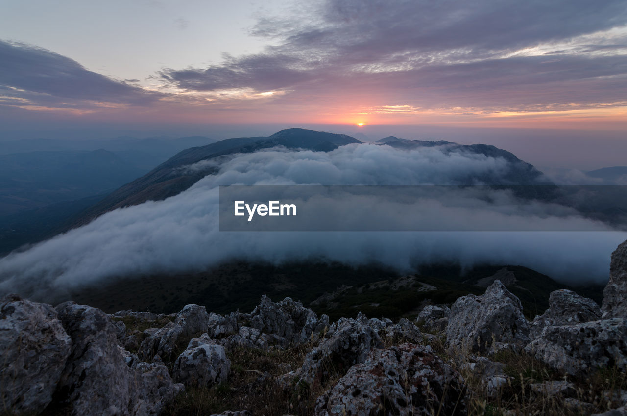 Scenic view of mountains against sky during sunset