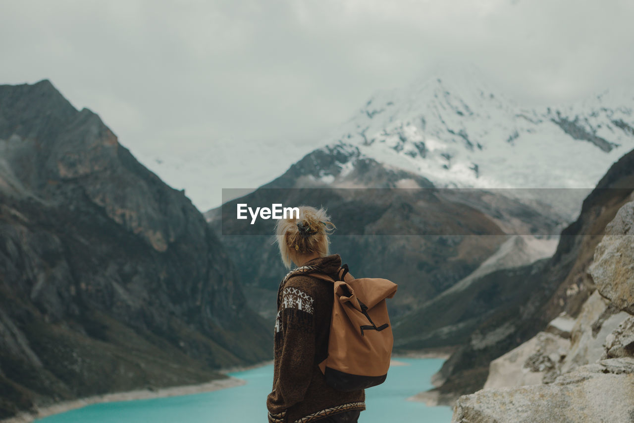 Rear view of woman looking at mountains