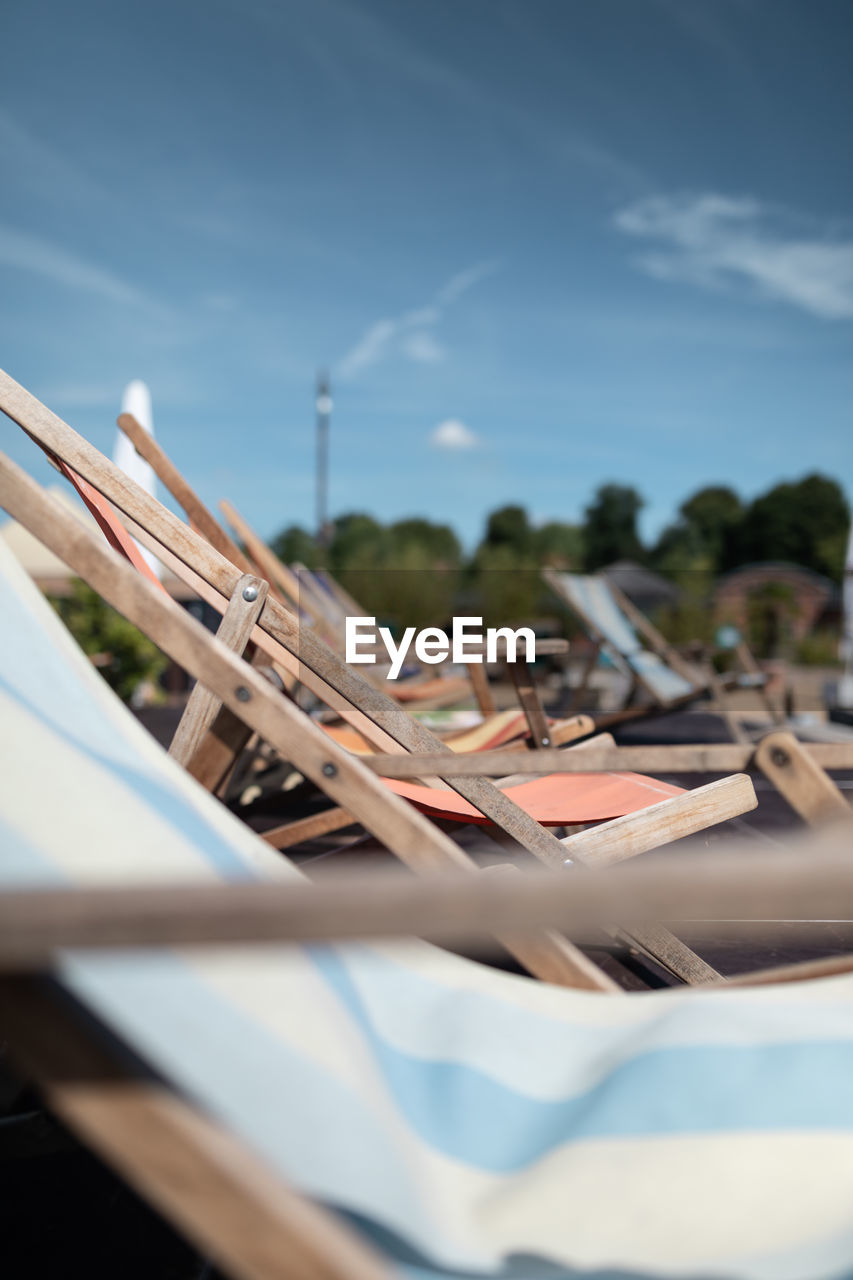 CLOSE-UP OF DECK CHAIRS ON TABLE