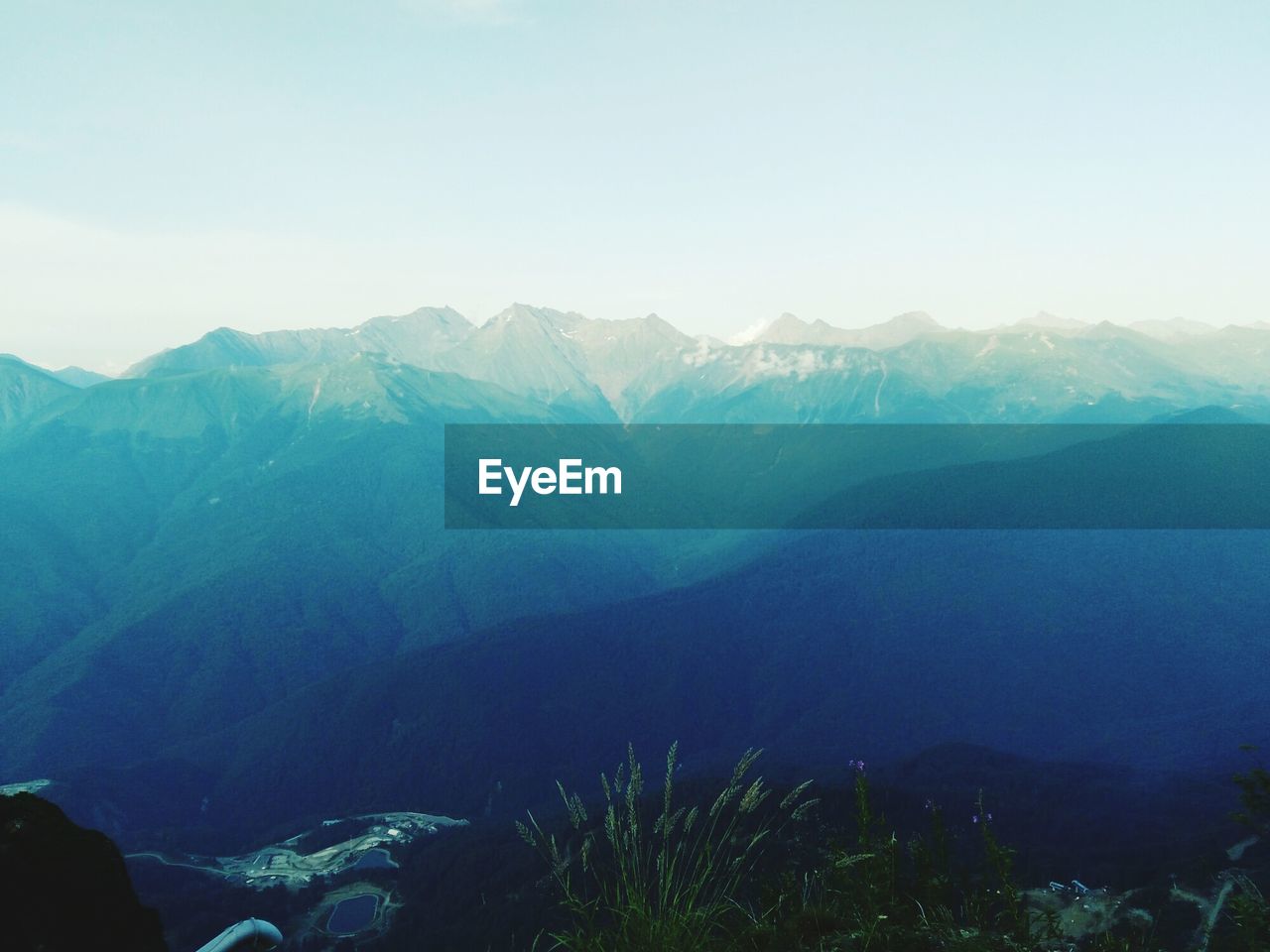 Scenic view of mountain against cloudy sky