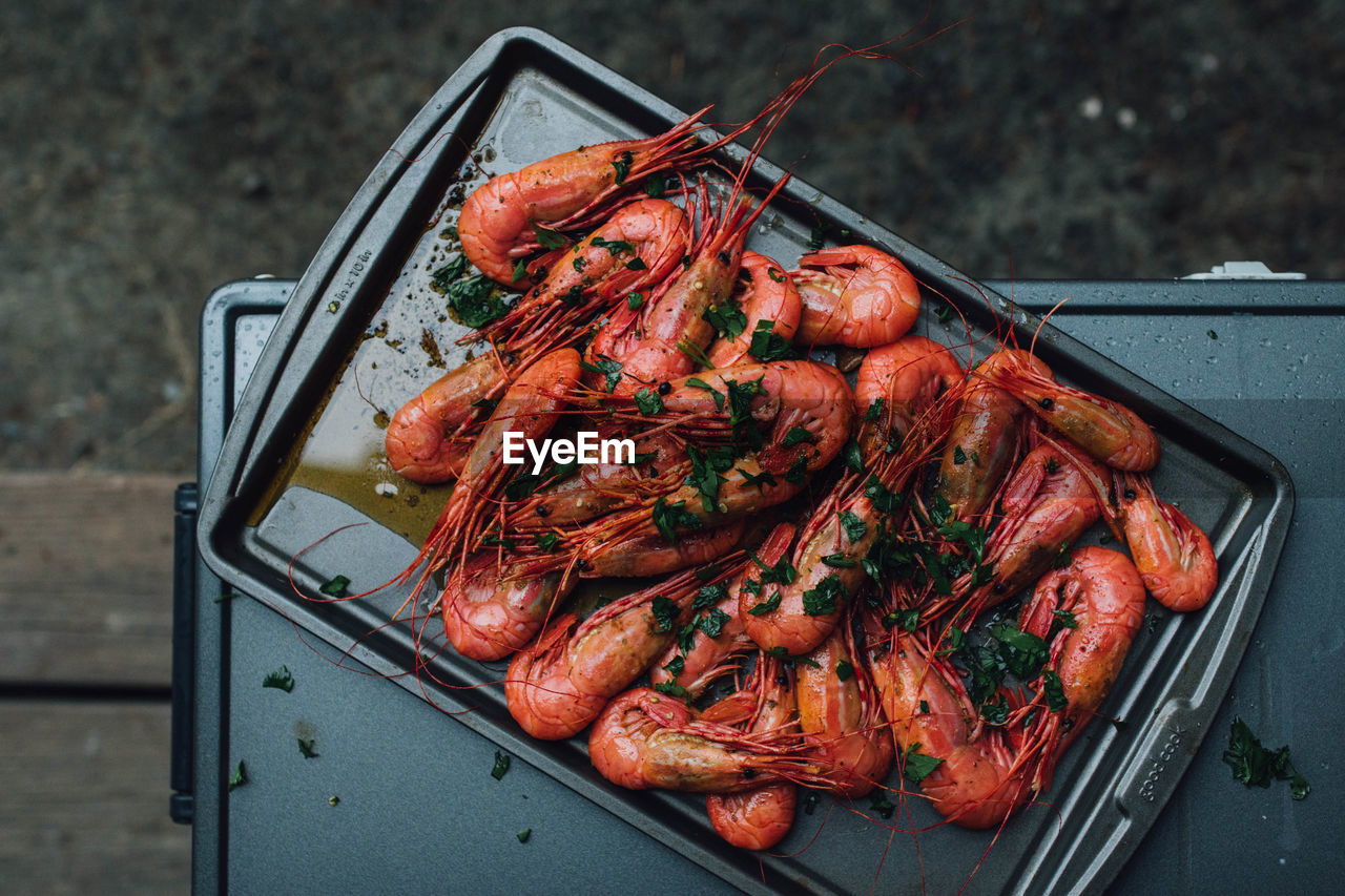 Spot prawns shrimp seafood in butter garlic parsley camping outdoors