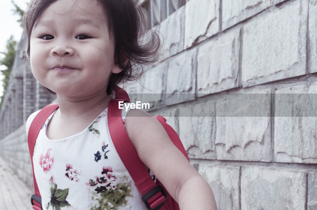 CLOSE-UP PORTRAIT OF CUTE SMILING BABY