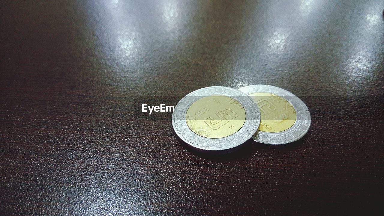 High angle view of coins on table