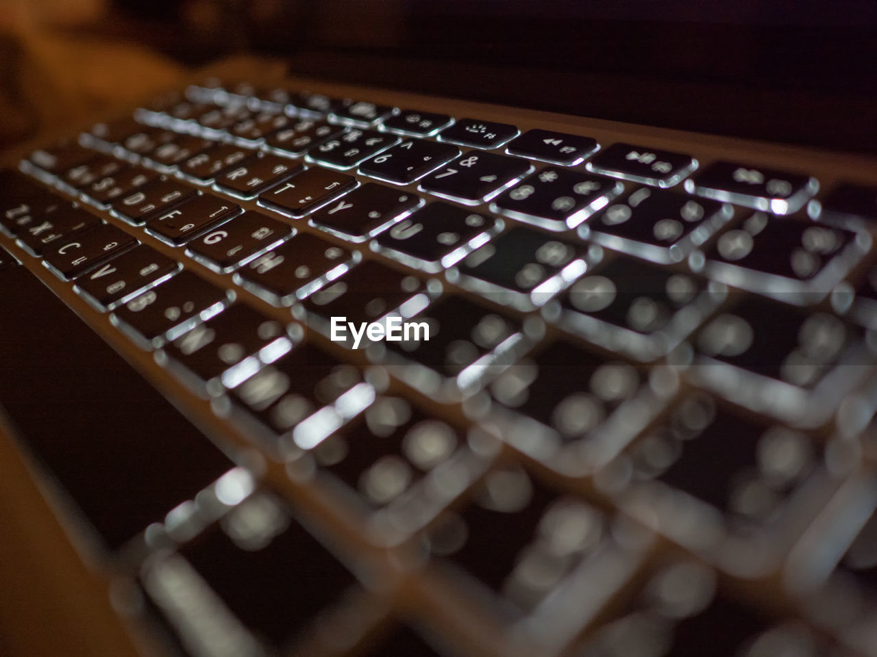 CLOSE-UP OF LAPTOP ON KEYBOARD