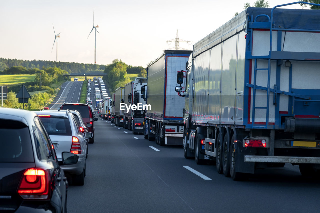 Rescue lane, cars and trucks during traffic jam in the evening, germany