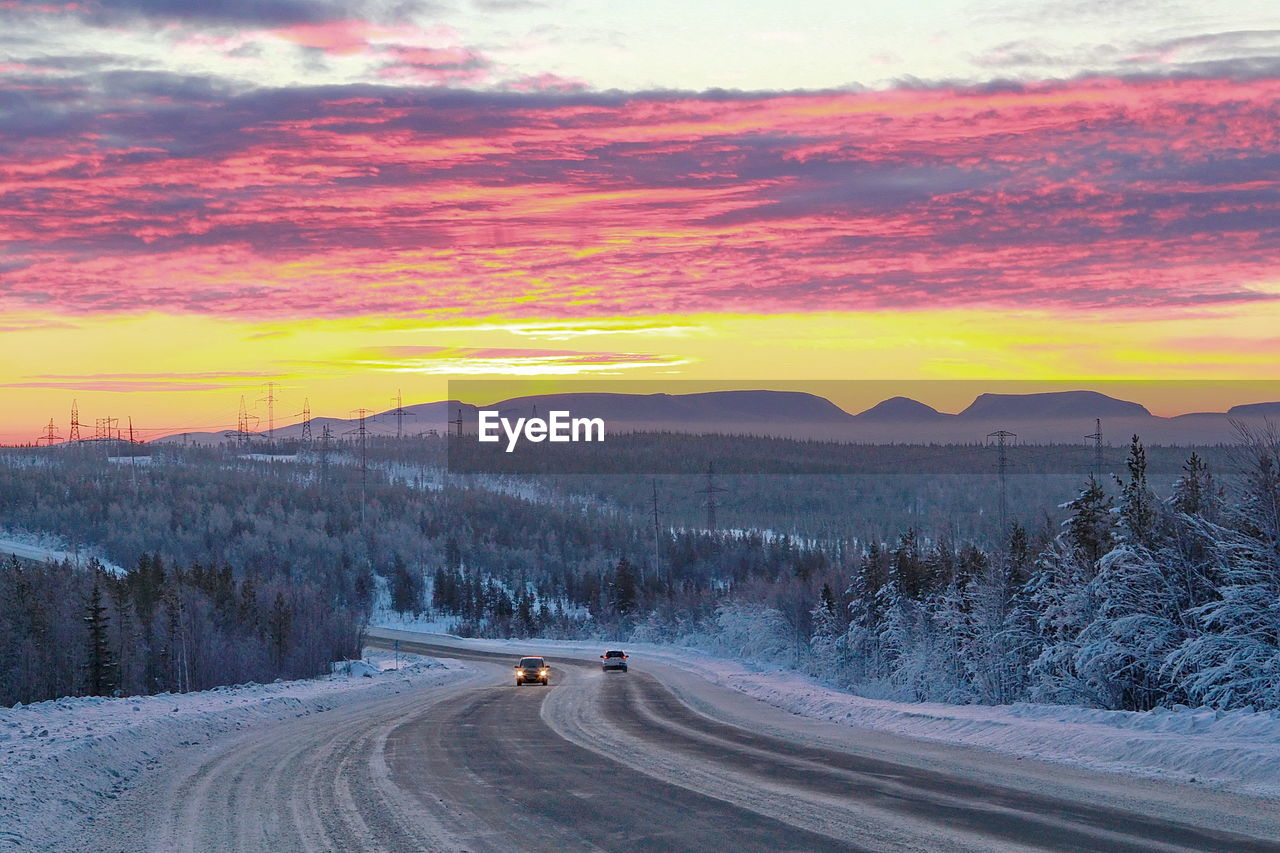 Scenic view of dramatic landscape during sunset