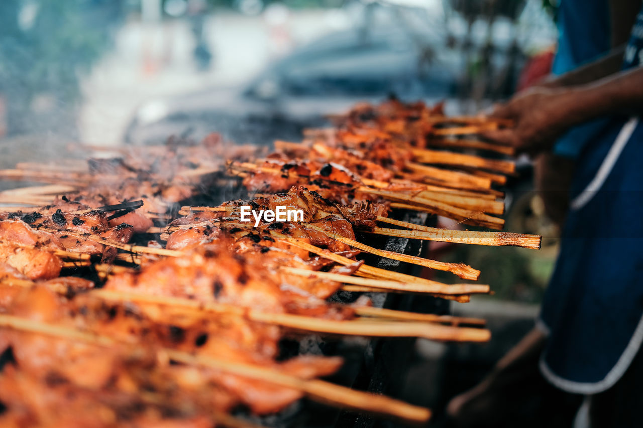 High angle view of meat on barbecue grill