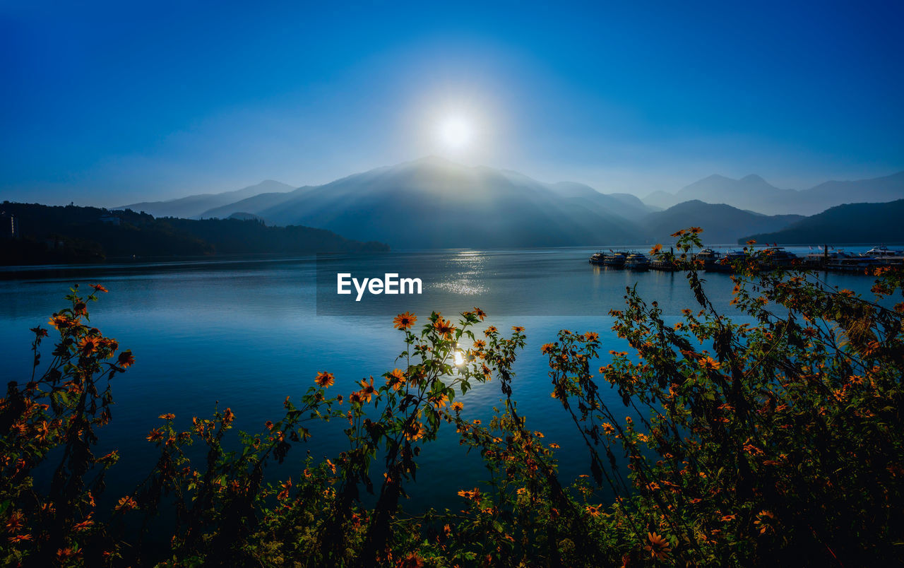 Scenic view of sea against blue sky