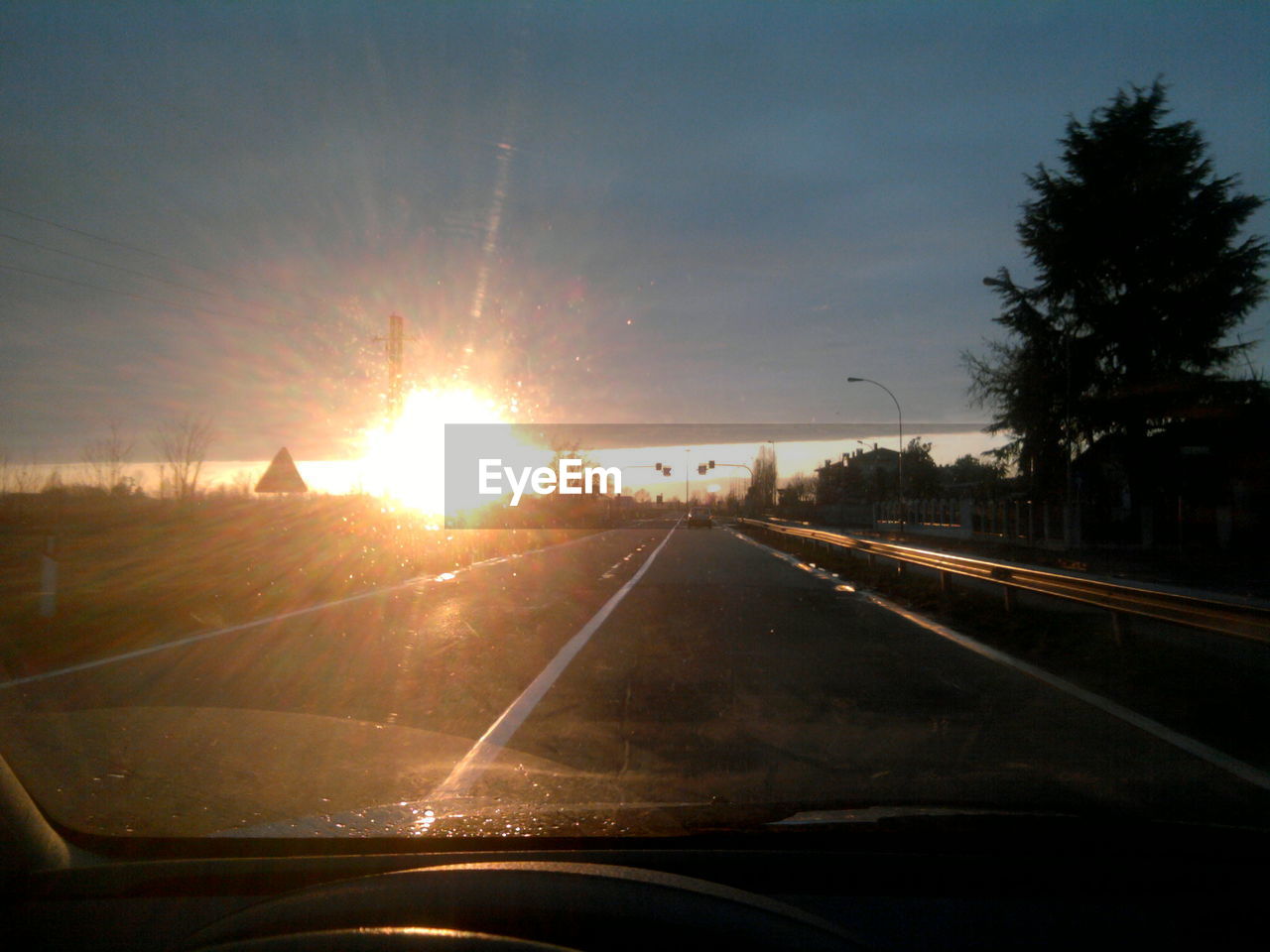 ROAD AGAINST SKY DURING SUNSET