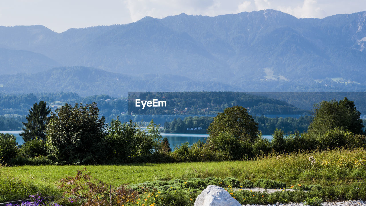 Scenic view of landscape and mountains against sky