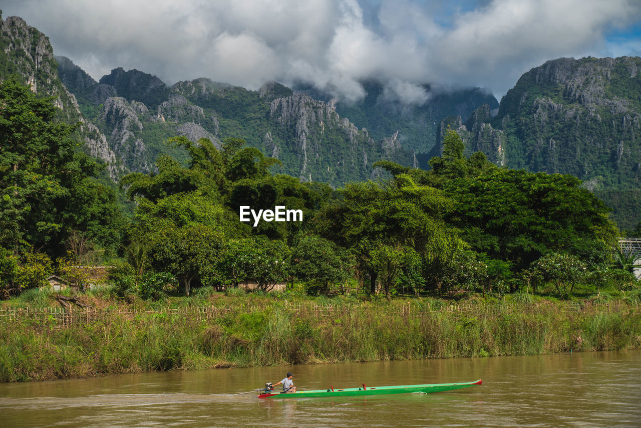 SCENIC VIEW OF LAKE AND MOUNTAINS