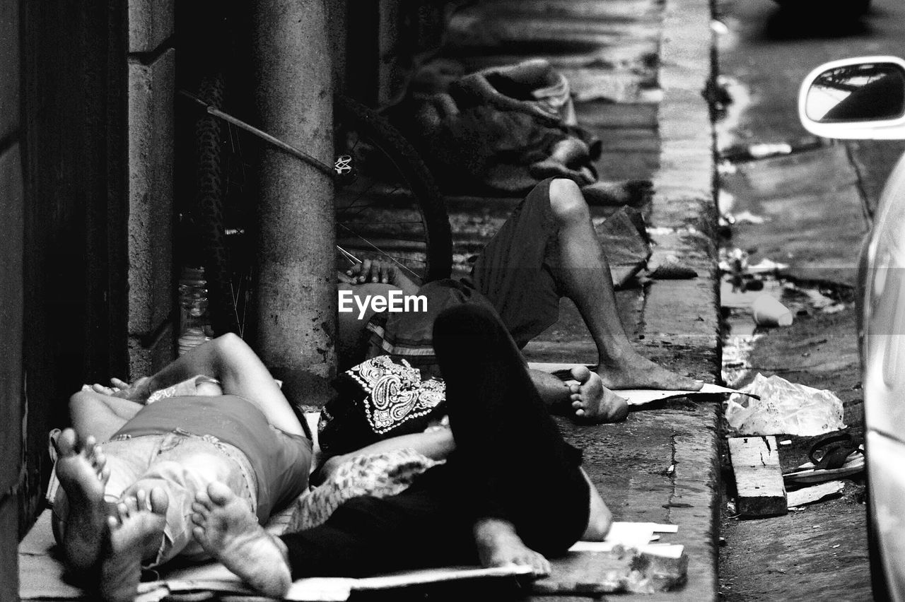 Homeless people sleeping on footpath