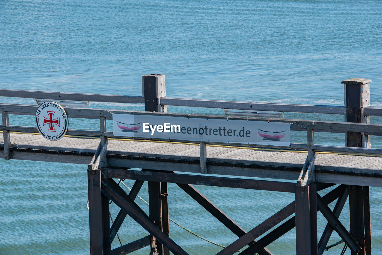 TEXT ON PIER AT SEA