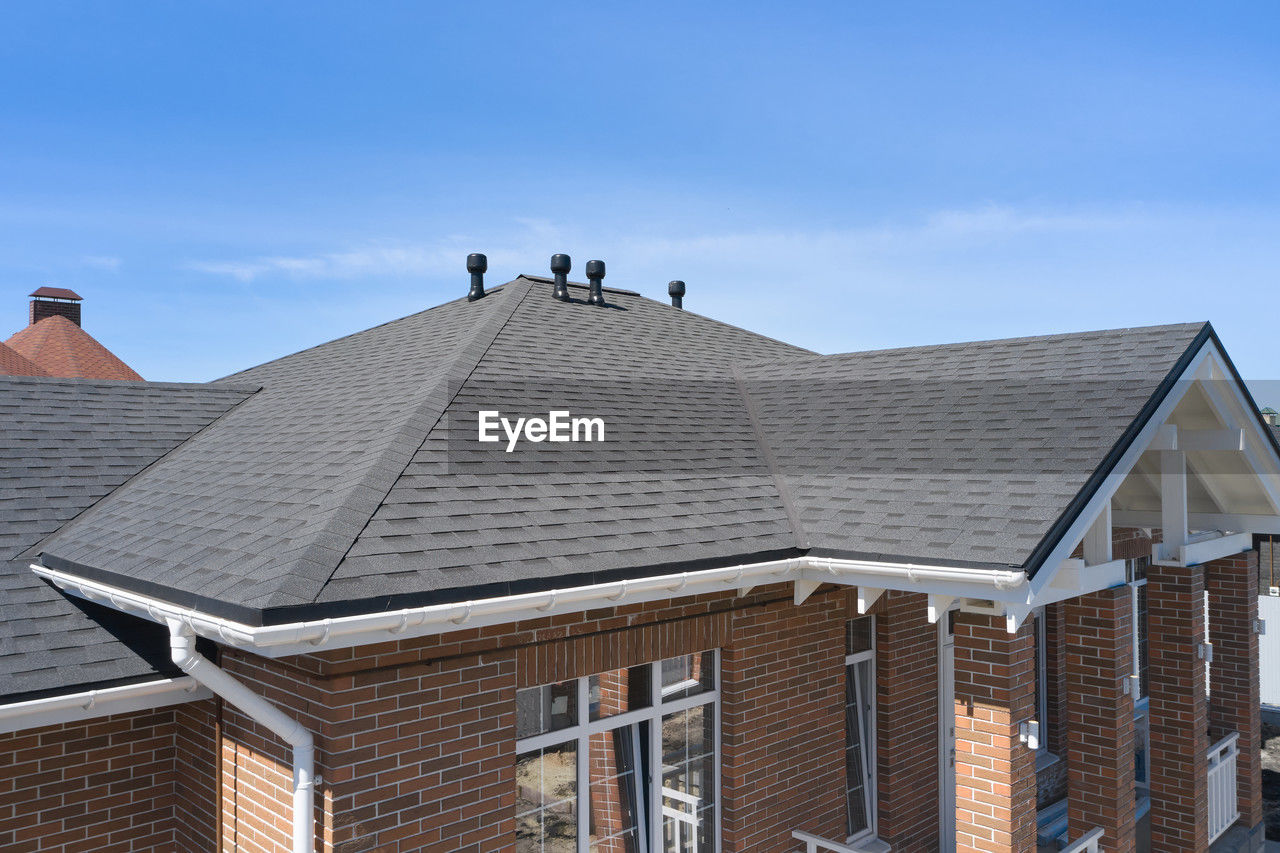 roof, architecture, building exterior, built structure, outdoor structure, sky, building, house, nature, city, day, facade, residential district, no people, outdoors, roof tile, blue, brick