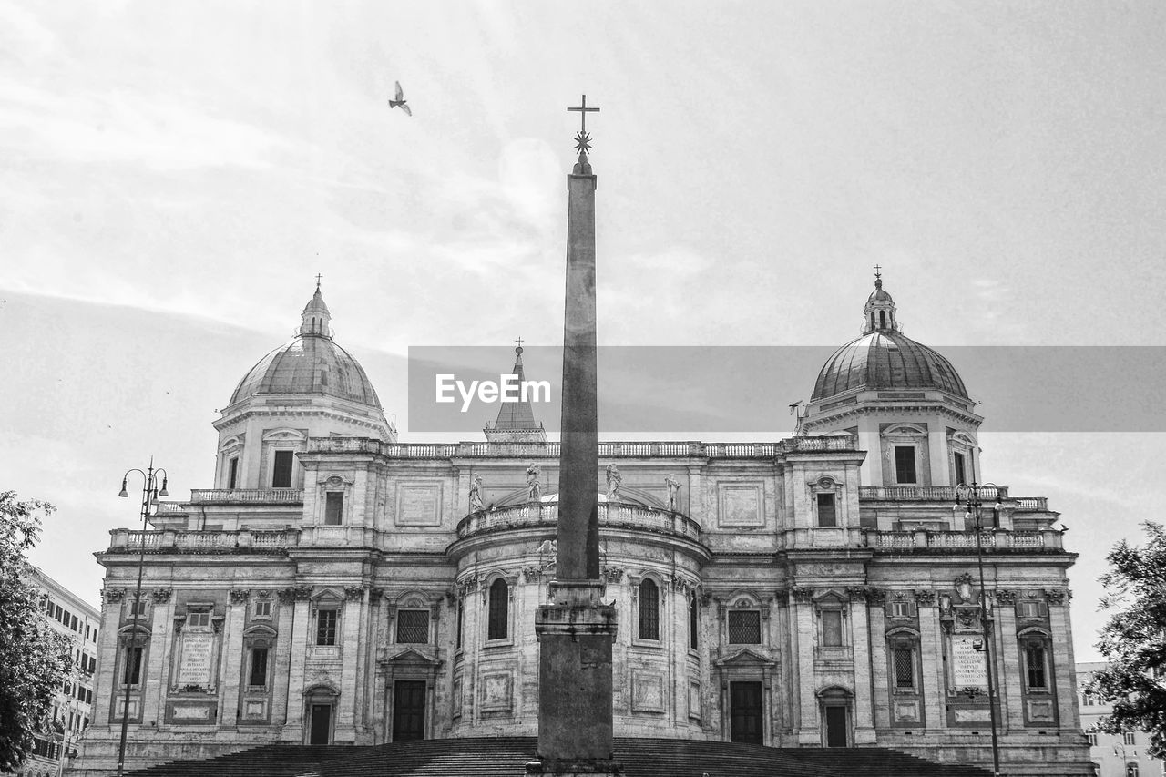 Low angle view of cathedral against cloudy sky