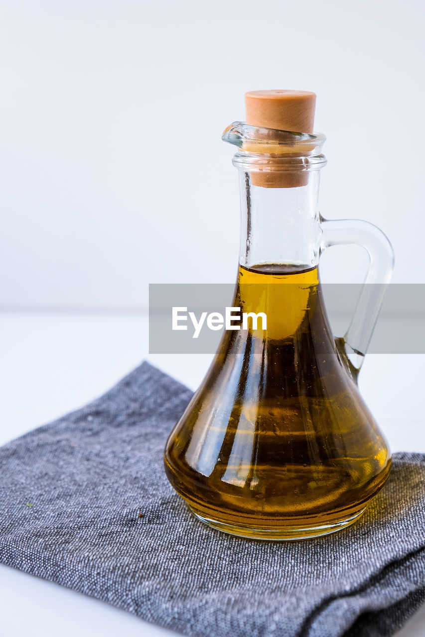 Fresh and delicious olive oil on kitchen towel. ingredients for food cooking. healthy eating. keto 
