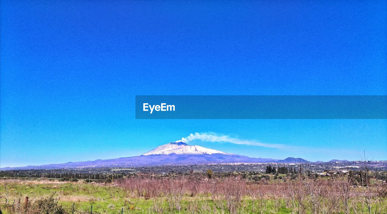 SCENIC VIEW OF MOUNTAIN AGAINST BLUE SKY